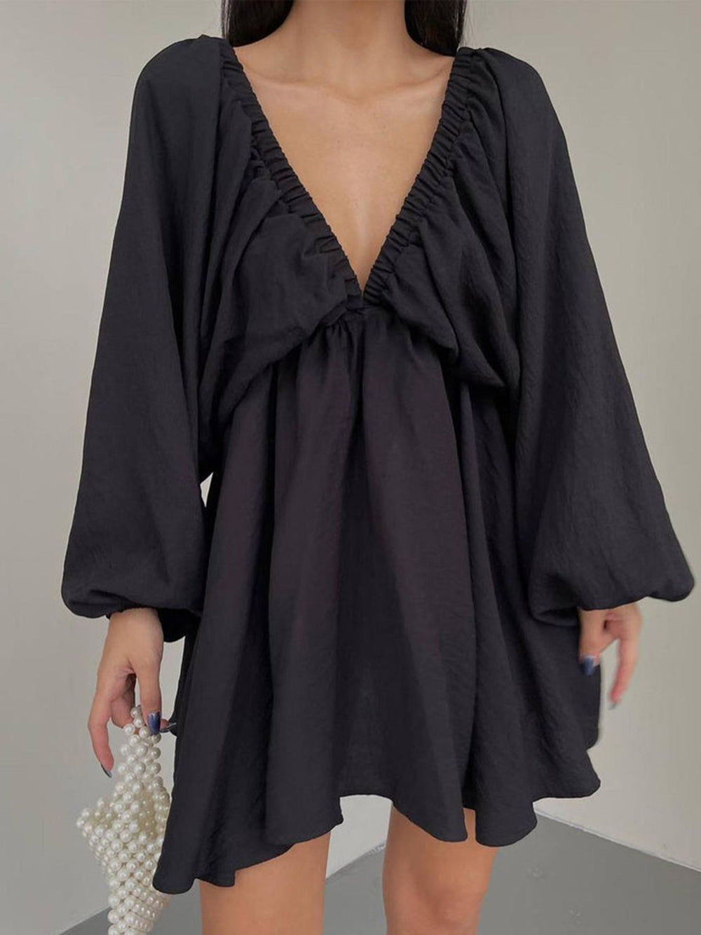 Mini skater dress made of fabric with deep neckline