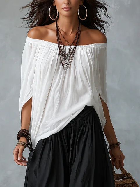 White off-shoulder top and lantern-style flared pants