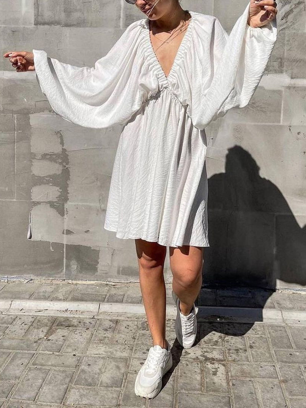 Mini skater dress made of fabric with deep neckline