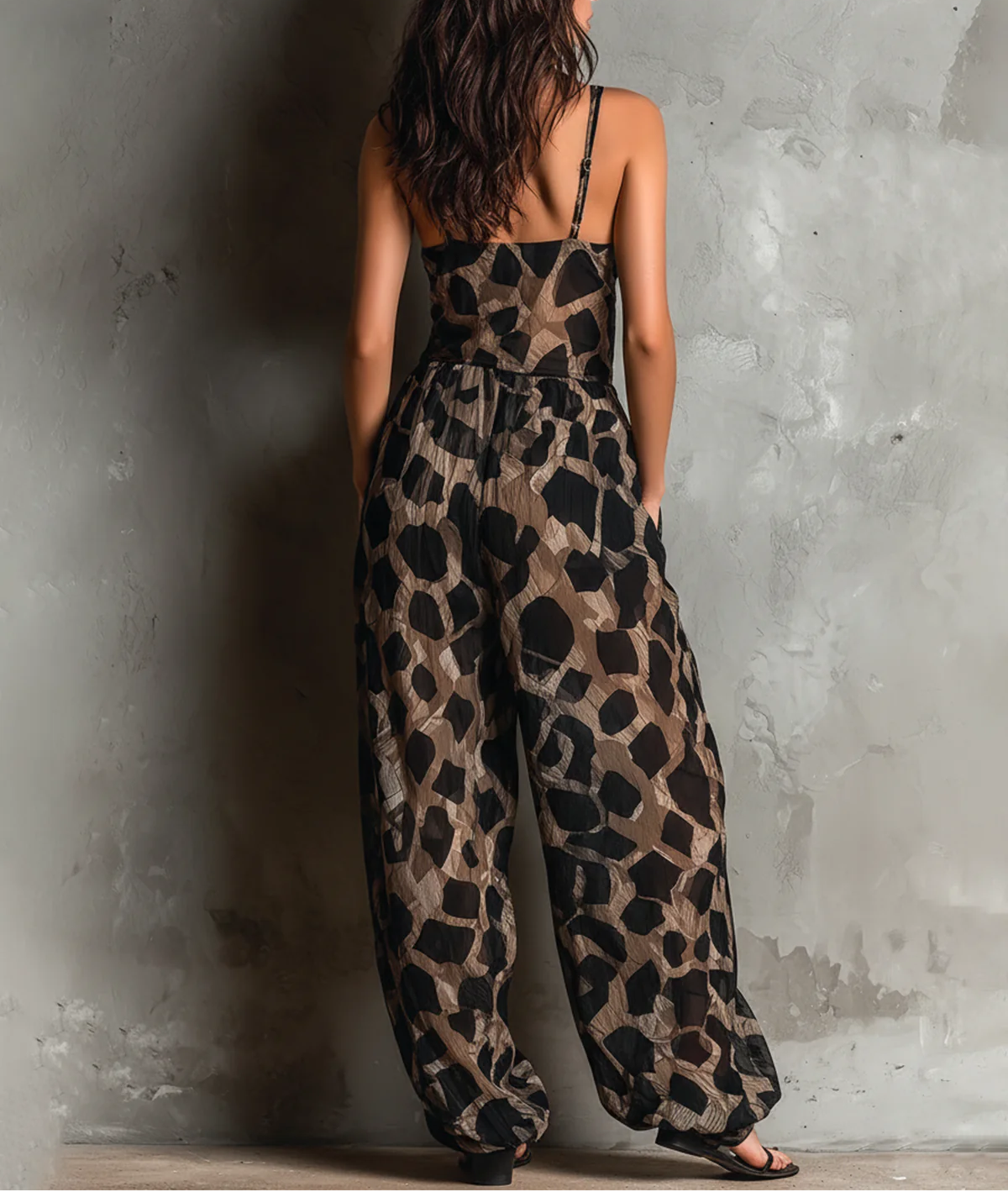 Roberta · Wide black chiffon jumpsuit with animal print, halter neck and pants