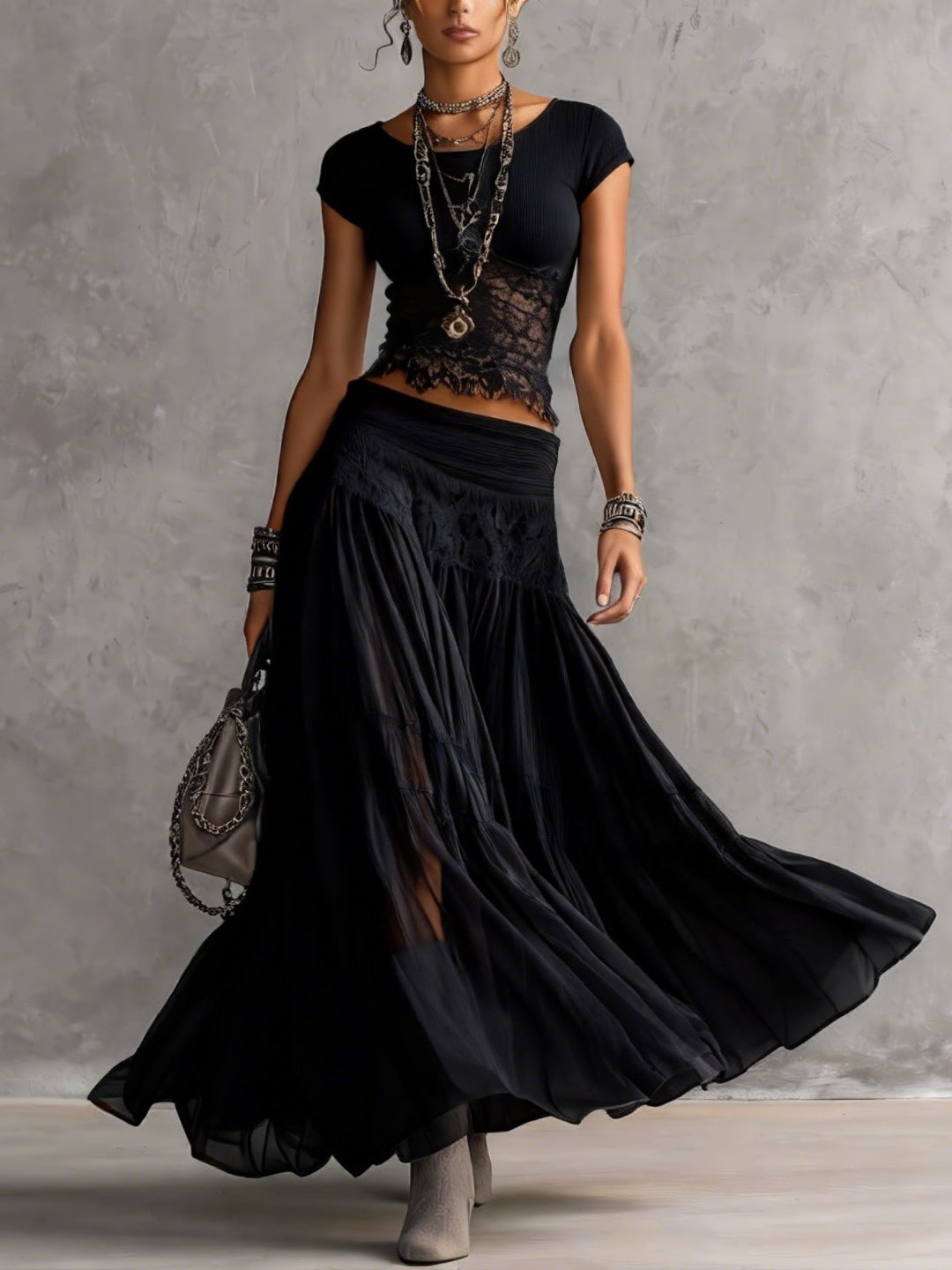 Geneva · Set consisting of a transparent top with black lace panels and a maxi pleated skirt